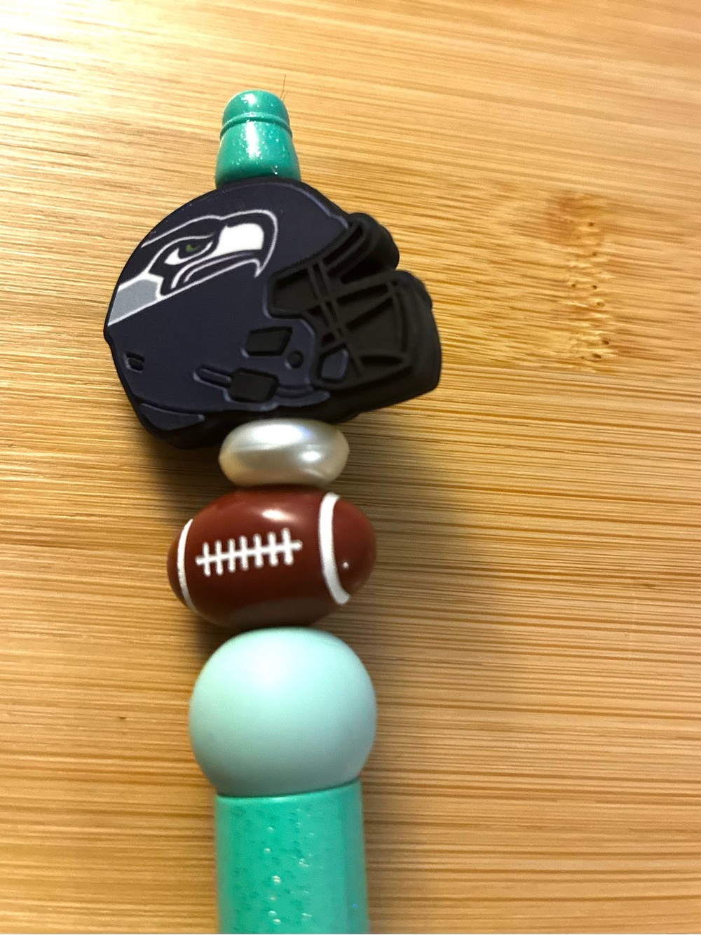 Teal Glitter Beaded Ballpoint Pen with Seahawks Football Bead